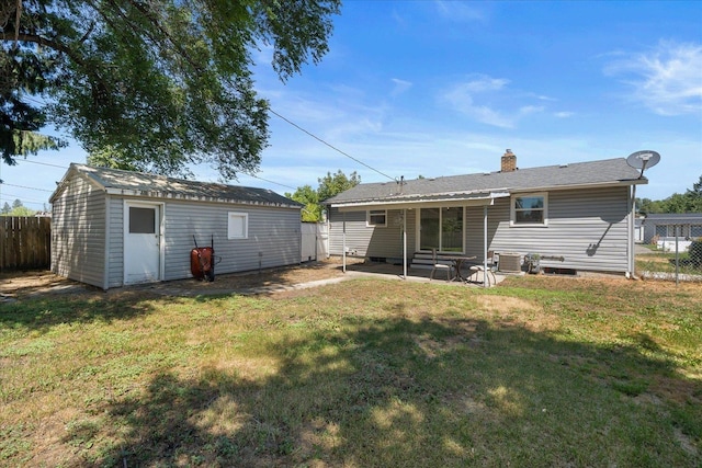 1634 E Dalke Ave, Spokane, WA 99208 - rear view of property with a patio area, a chimney, and an outbuilding