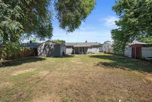 1634 E Dalke Ave, Spokane, WA 99208 - fenced backyard with a shed and a sunroom