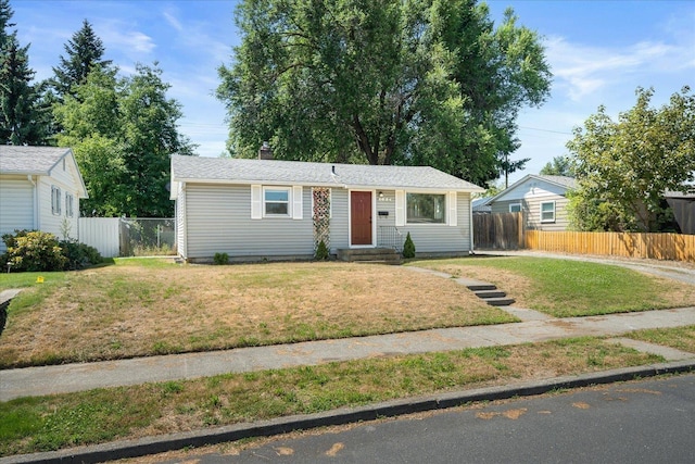 1634 E Dalke Ave, Spokane, WA 99208 - view of front of house featuring entry steps and a chimney