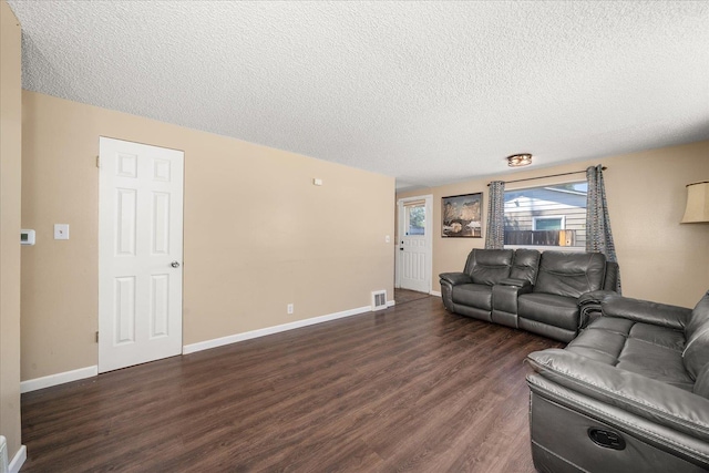 1634 E Dalke Ave, Spokane, WA 99208 - living area featuring dark wood-type flooring and a textured ceiling