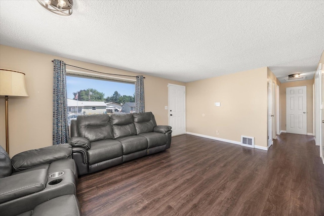 1634 E Dalke Ave, Spokane, WA 99208 - living area with dark wood-style flooring and a textured ceiling