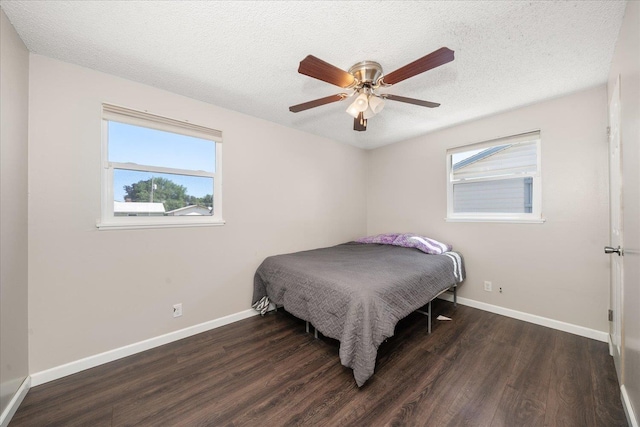 1634 E Dalke Ave, Spokane, WA 99208 - bedroom featuring wood finished floors, a textured ceiling, and a ceiling fan