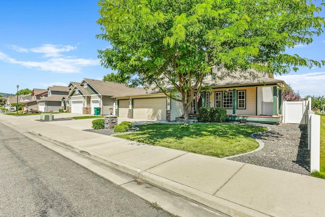12837 E 37th Ln, Spokane Valley, WA 99206 - view of front of home with an attached garage, driveway, a porch, and a residential view