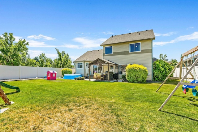 12837 E 37th Ln, Spokane Valley, WA 99206 - back of property featuring a gazebo, a hot tub, a fenced backyard, and a patio
