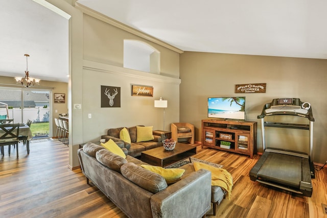 12837 E 37th Ln, Spokane Valley, WA 99206 - living room featuring wood finished floors, a chandelier, and vaulted ceiling