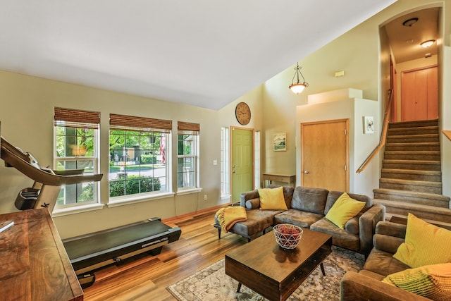 12837 E 37th Ln, Spokane Valley, WA 99206 - living room with stairway, wood finished floors, arched walkways, and high vaulted ceiling