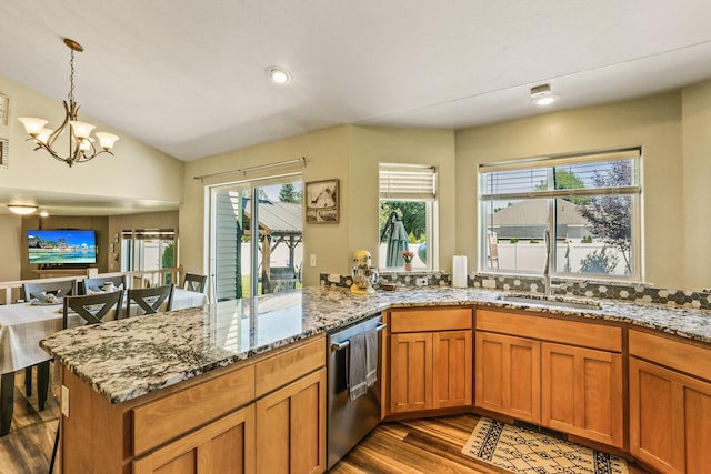 12837 E 37th Ln, Spokane Valley, WA 99206 - kitchen with stainless steel dishwasher, wood finished floors, a chandelier, healthy amount of natural light, and vaulted ceiling