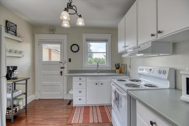 4028 N Post St, Spokane, WA 99205 - kitchen featuring electric stove, under cabinet range hood, light countertops, and white cabinets