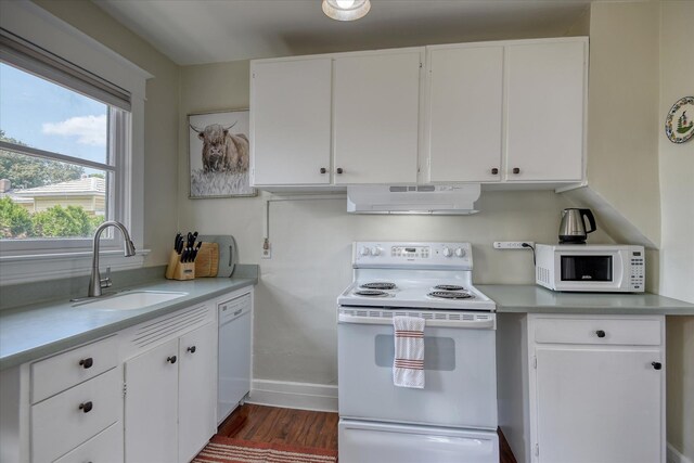4028 N Post St, Spokane, WA 99205 - kitchen featuring white appliances, under cabinet range hood, light countertops, and white cabinets