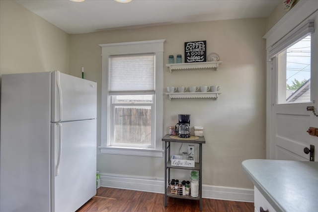 4028 N Post St, Spokane, WA 99205 - kitchen with freestanding refrigerator and dark wood finished floors