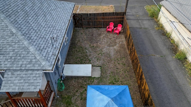 4028 N Post St, Spokane, WA 99205 - exterior view of a shingled roof and a fenced backyard