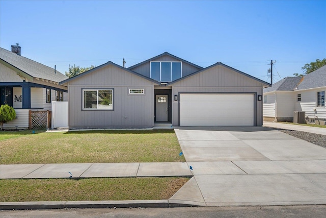 2912 E Wabash Ave, Spokane, WA 99217 - view of front of house with an attached garage, a front yard, and driveway