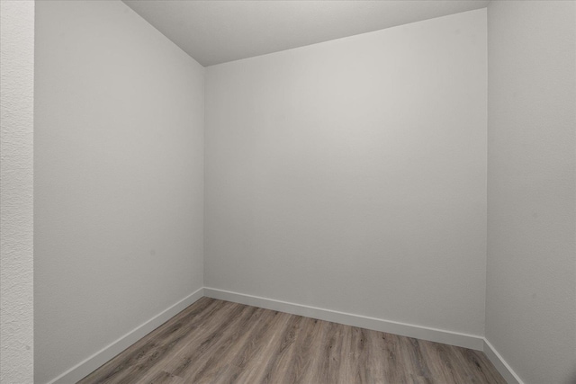 2912 E Wabash Ave, Spokane, WA 99217 - empty room with wood finished floors and lofted ceiling