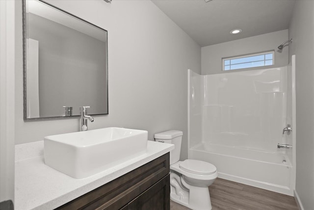 2912 E Wabash Ave, Spokane, WA 99217 - bathroom featuring vanity,  shower combination, wood finished floors, and recessed lighting
