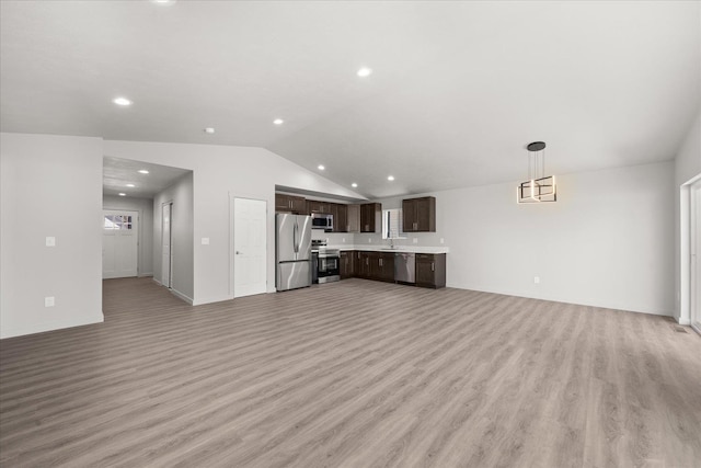 2912 E Wabash Ave, Spokane, WA 99217 - unfurnished living room with light wood finished floors, lofted ceiling, and recessed lighting