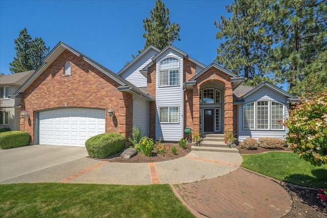 5203 S S Hogan Ct, Spokane, WA 99223 - traditional home with a garage, concrete driveway, brick siding, and a front lawn