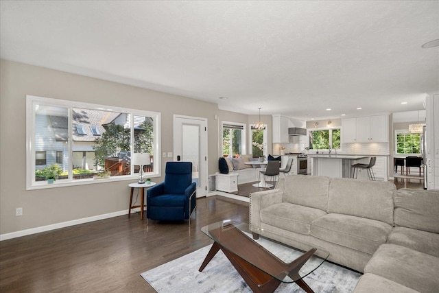 5203 S S Hogan Ct, Spokane, WA 99223 - living room with dark wood finished floors, recessed lighting, and a chandelier