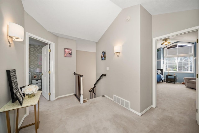 5203 S S Hogan Ct, Spokane, WA 99223 - hallway featuring an upstairs landing, light carpet, and vaulted ceiling