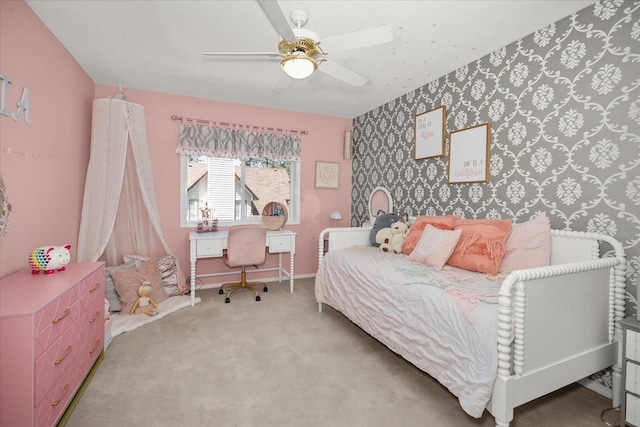 5203 S S Hogan Ct, Spokane, WA 99223 - carpeted bedroom with wallpapered walls, a ceiling fan, and an accent wall