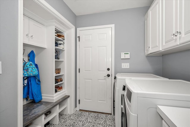 5203 S S Hogan Ct, Spokane, WA 99223 - laundry area with cabinet space, washing machine and dryer, and light tile patterned floors