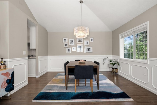 5203 S S Hogan Ct, Spokane, WA 99223 - dining area featuring vaulted ceiling, a chandelier, dark wood-style flooring, wainscoting, and a decorative wall