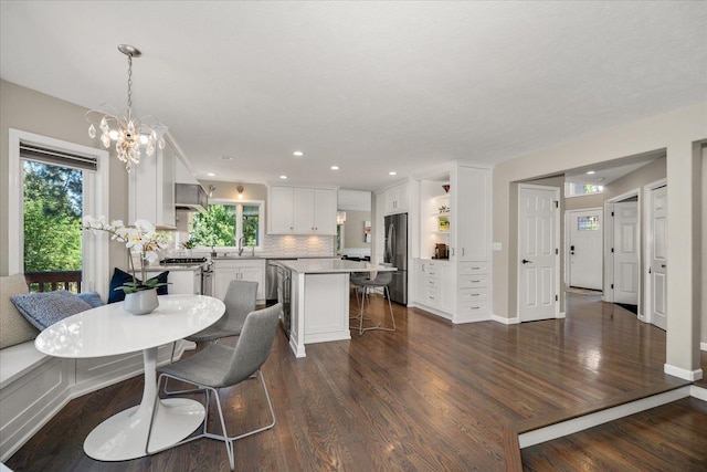 5203 S S Hogan Ct, Spokane, WA 99223 - dining space featuring plenty of natural light, dark wood-style floors, a chandelier, and recessed lighting