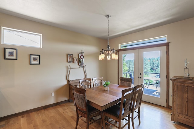 1604 N Rim View St, Spokane, WA 99224 - dining space featuring french doors, light wood finished floors, and a chandelier