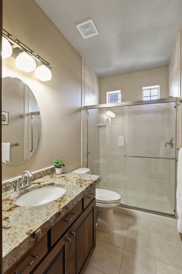 1604 N Rim View St, Spokane, WA 99224 - full bath with vanity, a shower stall, and tile patterned flooring