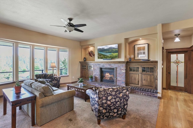 1604 N Rim View St, Spokane, WA 99224 - living area featuring ceiling fan, a brick fireplace, and wood finished floors