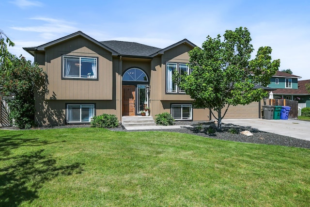 18017 N Lidgerwood Ct, Colbert, WA 99005 - split foyer home featuring driveway, a front lawn, and a garage