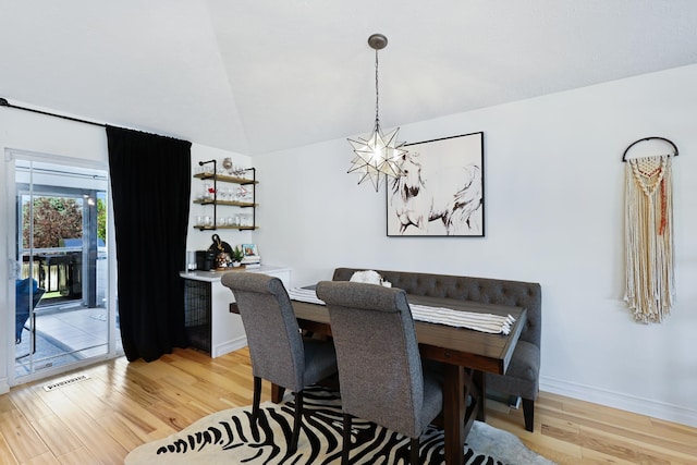 18017 N Lidgerwood Ct, Colbert, WA 99005 - dining room with light wood finished floors, a chandelier, and vaulted ceiling