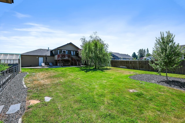 18017 N Lidgerwood Ct, Colbert, WA 99005 - fenced backyard with stairs, a wooden deck, and a patio area