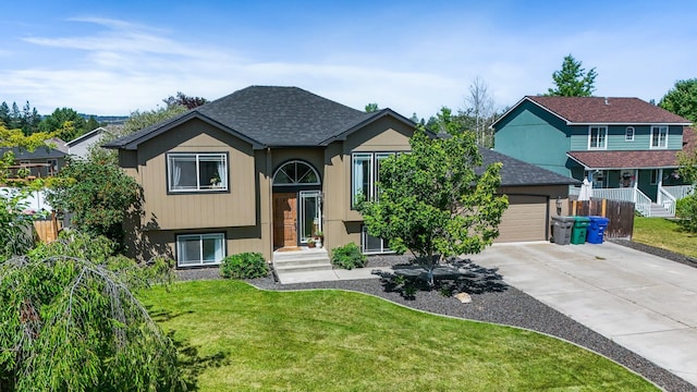 18017 N Lidgerwood Ct, Colbert, WA 99005 - bi-level home with driveway, a garage, and a shingled roof