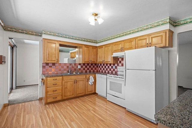 11622 E 24th Ave, Spokane Valley, WA 99206 - kitchen featuring white appliances, light wood finished floors, under cabinet range hood, decorative backsplash, and dark stone countertops