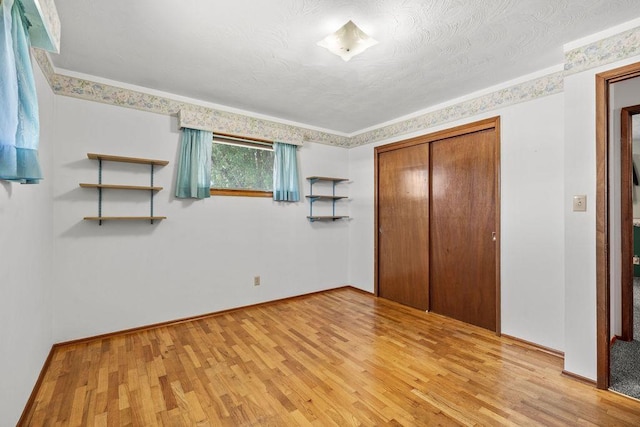 11622 E 24th Ave, Spokane Valley, WA 99206 - unfurnished bedroom featuring light wood-style flooring and a closet