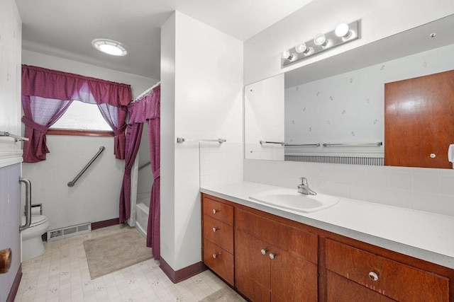 11622 E 24th Ave, Spokane Valley, WA 99206 - full bath featuring vanity, shower / bathtub combination with curtain, tile patterned floors, and tasteful backsplash