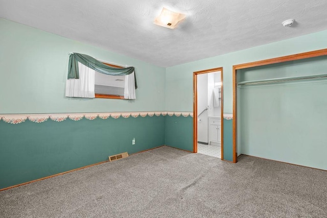 11622 E 24th Ave, Spokane Valley, WA 99206 - unfurnished bedroom featuring carpet and a closet