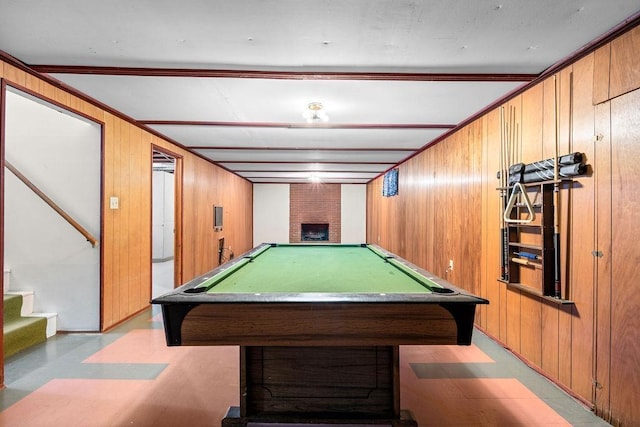 11622 E 24th Ave, Spokane Valley, WA 99206 - rec room with wood walls, billiards table, a brick fireplace, and light flooring