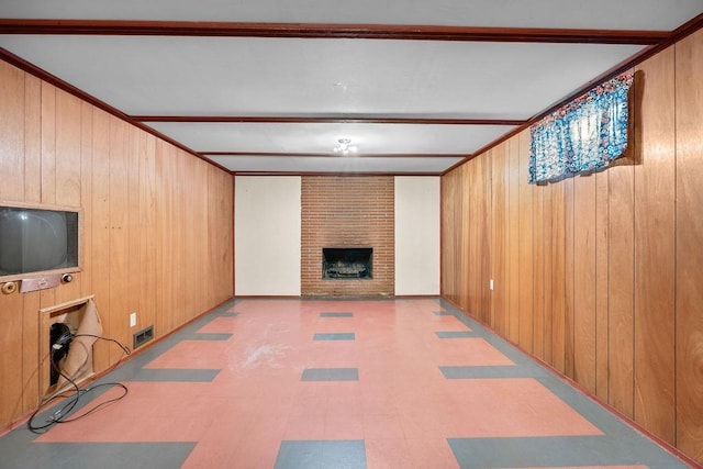 11622 E 24th Ave, Spokane Valley, WA 99206 - unfurnished living room featuring wood walls, tile patterned floors, and a fireplace