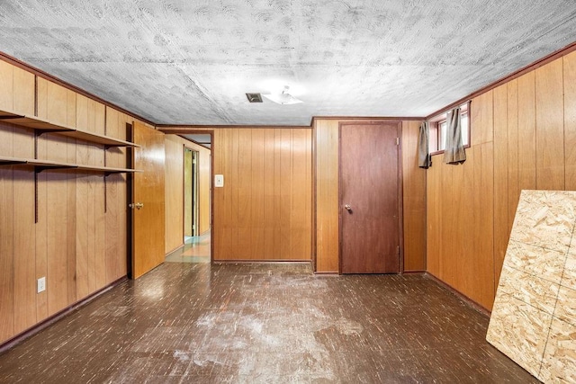 11622 E 24th Ave, Spokane Valley, WA 99206 - unfurnished bedroom featuring wood walls and wood finished floors