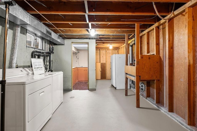 11622 E 24th Ave, Spokane Valley, WA 99206 - unfinished below grade area with washing machine and dryer and freestanding refrigerator