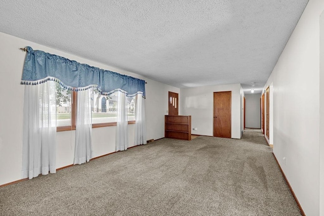 11622 E 24th Ave, Spokane Valley, WA 99206 - spare room with a textured ceiling and carpet flooring
