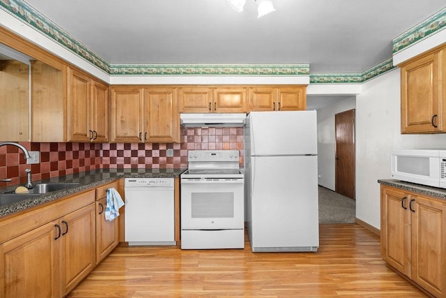 11622 E 24th Ave, Spokane Valley, WA 99206 - kitchen featuring white appliances, under cabinet range hood, light wood-style floors, and decorative backsplash