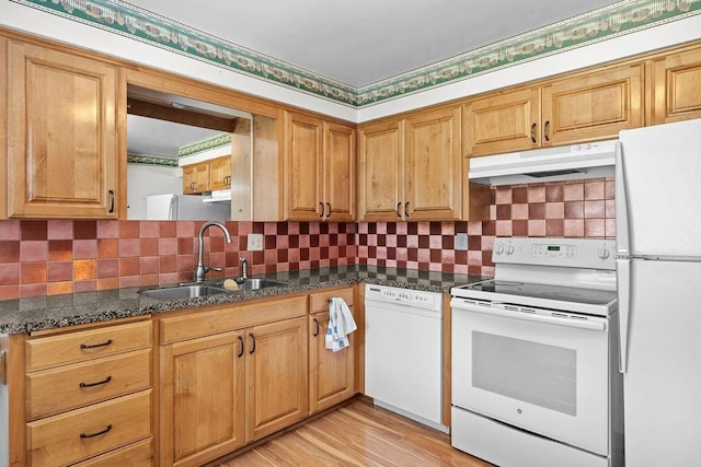 11622 E 24th Ave, Spokane Valley, WA 99206 - kitchen with white appliances, under cabinet range hood, light wood-style flooring, backsplash, and dark stone counters