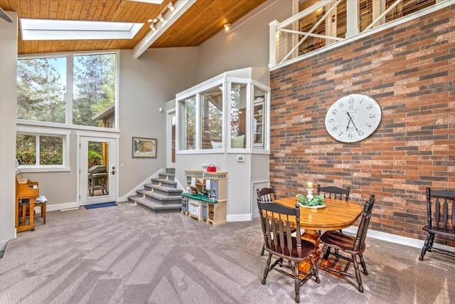 3222 S Conklin Rd, Greenacres, WA 99016 - carpeted dining room featuring a high ceiling, a wooden ceiling with exposed beams, and plenty of natural light