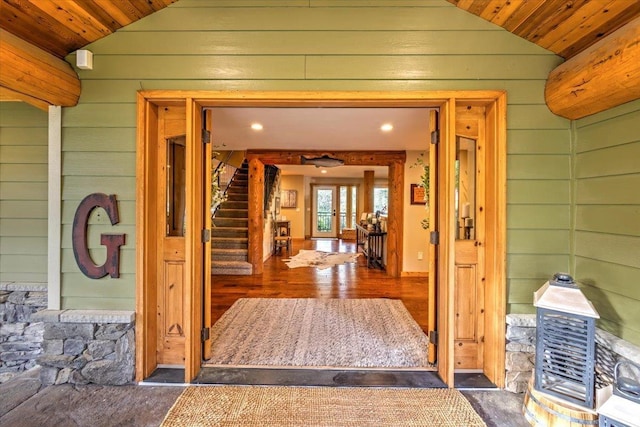 3222 S Conklin Rd, Greenacres, WA 99016 - hallway featuring lofted ceiling, wooden walls, wooden ceiling, stairway, and wood finished floors