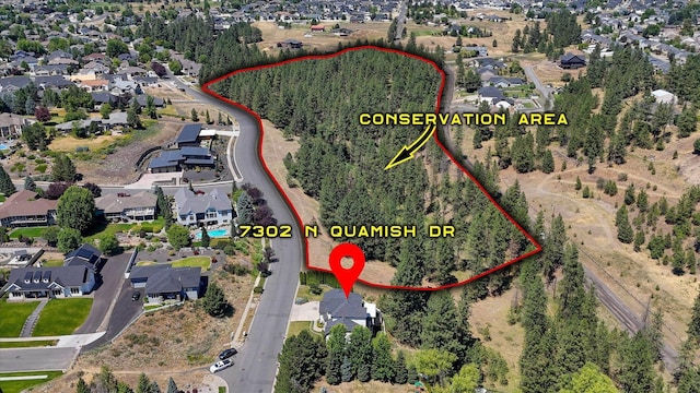 7302 N Quamish Dr, Spokane, WA 99208 - aerial perspective of suburban area featuring property boundaries highlighted