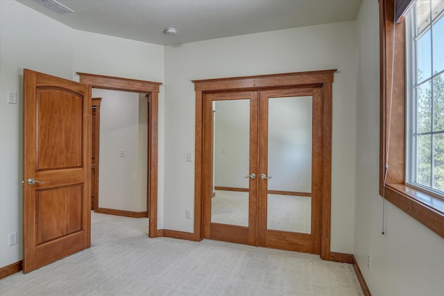 7302 N Quamish Dr, Spokane, WA 99208 - empty room featuring french doors and light colored carpet