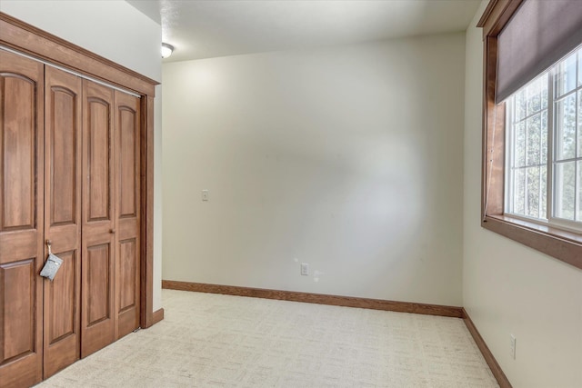 7302 N Quamish Dr, Spokane, WA 99208 - unfurnished bedroom featuring light colored carpet