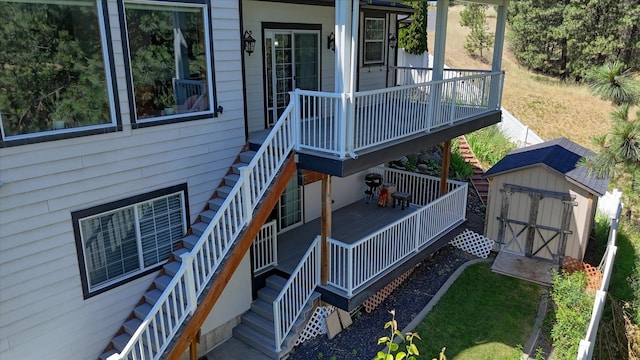 7302 N Quamish Dr, Spokane, WA 99208 - wooden terrace with stairway and a storage shed